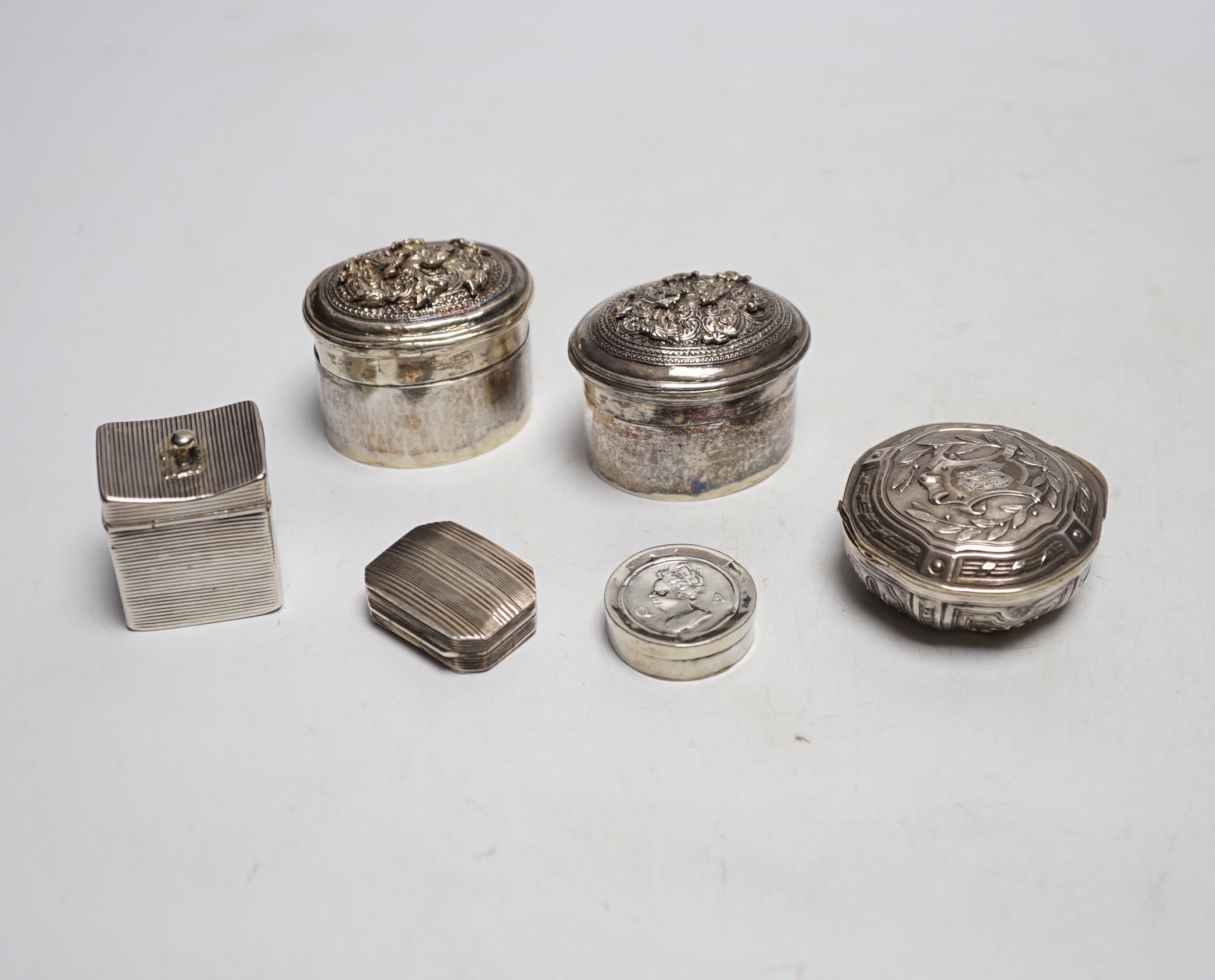 Assorted silver and white metal pill boxes, including Dutch, together with a 19th century vinaigrette by Samuel Pemberton, 30mm.